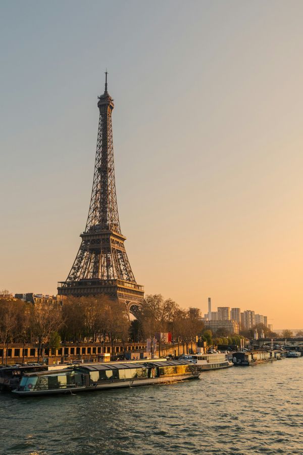 The Eiffel Tower and Seine River in Paris at sunset